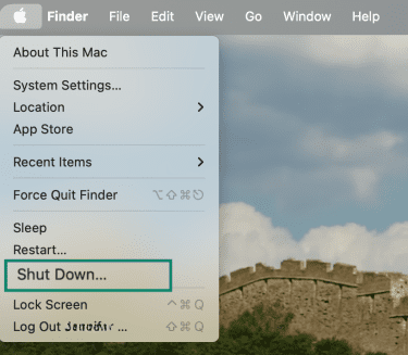 Apple menu open in macOS with “Shut Down…” option highlighted in the dropdown