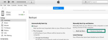 iPhone section on iTunes Windows app with Restore Backup button highlighted.