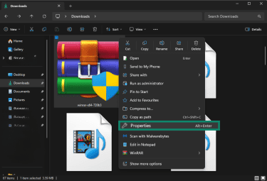 Windows download folder with WinRAR installer options menu open