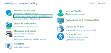 Windows Control Panel with Save backup copies of your files with File History highlighted.