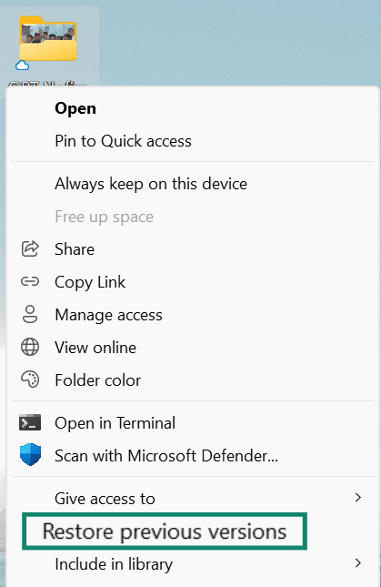 The expanded file menu window is open with Restore previous versions highlighted.